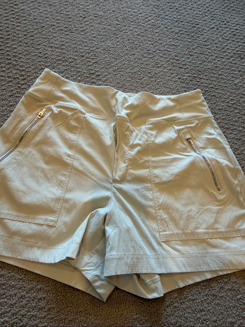 Athleta Light Cream Athletic Shorts with Zip Pockets